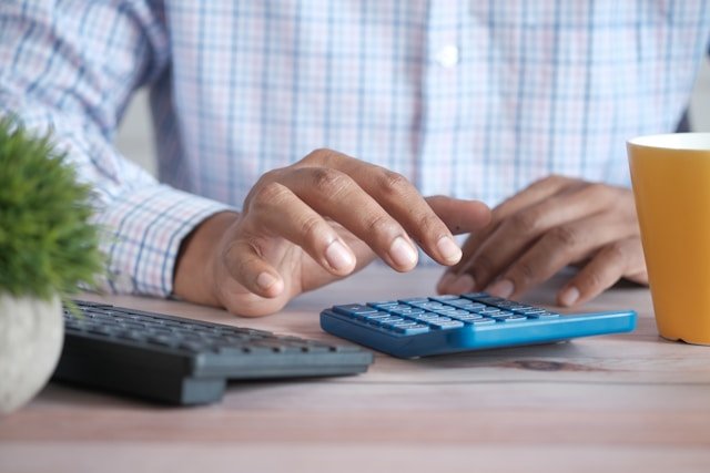Calculator debt paperwork